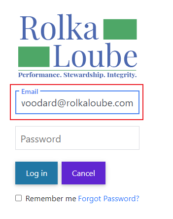 Rolka Loube logo with email text box highlighted and email entered in.  Below that, password text box is empty. Below that to the left  is a log in button and to the right of that is a cancel button. Below the buttons is a check box with the words Remember me next to it.  To the right of that are the words forgot password in blue.