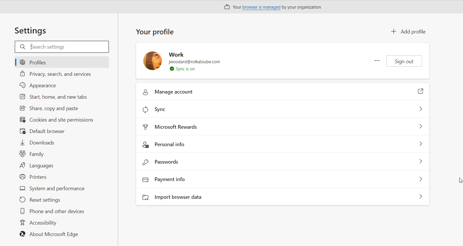 On the left there is a menu called Settings with many options below it. On the right is a menu called work with options to manage account, sync, microsoft rewards, personal info, passwords, payment info, and import browser data.